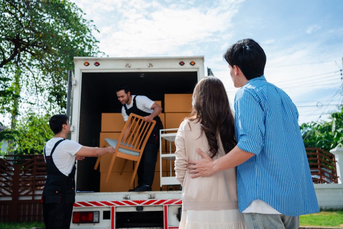 Hauling crew removing furniture from a residential property